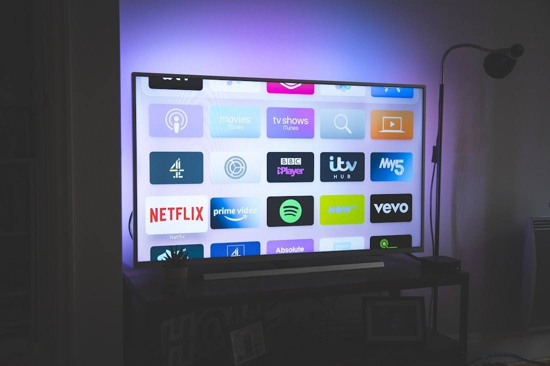 TV showing streaming app tiles on a wall mount